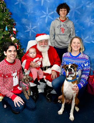 Mike and his family with Santa Claus