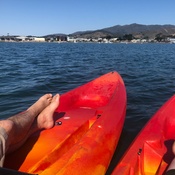Two kayaks on a lake.